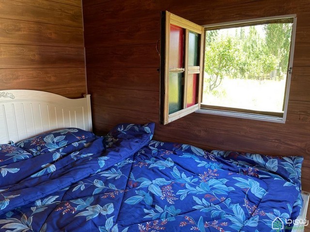 کلبه چوبی رو به رودخانه